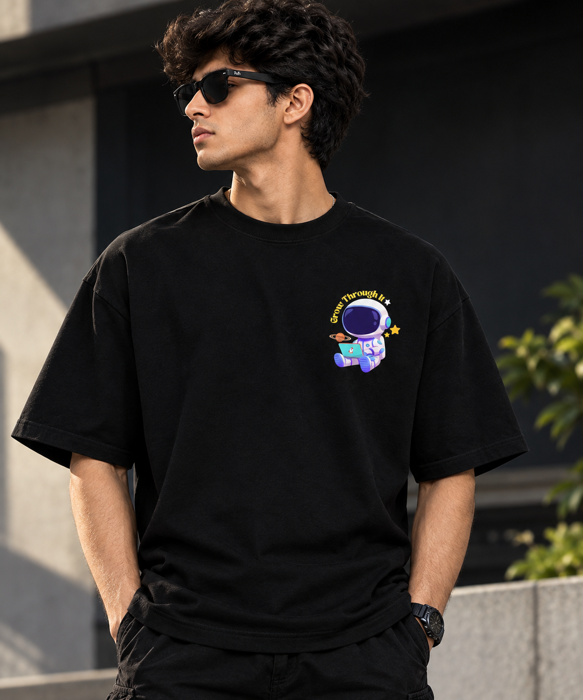 VAYUQ Grow Through It Astronaut Graphic Tee. Black